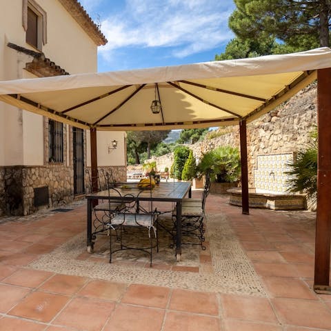 Tuck into some home-cooked Spanish cuisine on the covered terrace