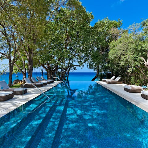 Dive in for a morning swim and gaze out at the Caribbean Sea