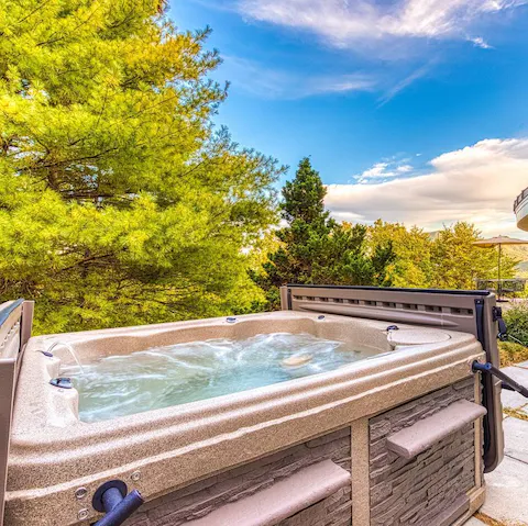 Unwind in the private hot tub after a day of hiking