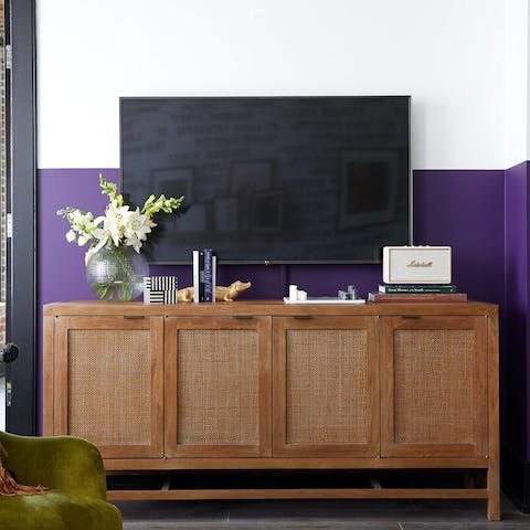 Relax in front of the TV in the vibrantly decorated living area