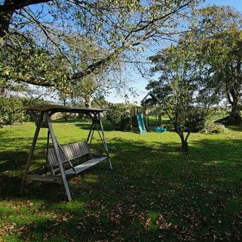 Have a glass of wine in the garden as the little ones take to the play set