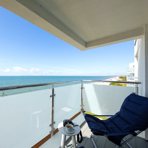 Watch the sun reflecting off the sea from the private balcony