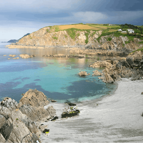 Walk down to the sandy beach at Lee Bay in under ten minutes