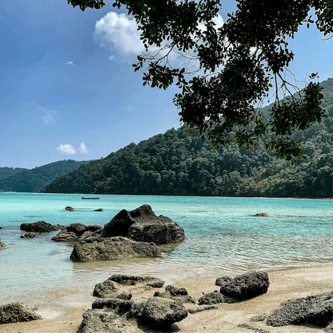 Spend your days in the crystalline waters of Surin Beach,  just 700m away