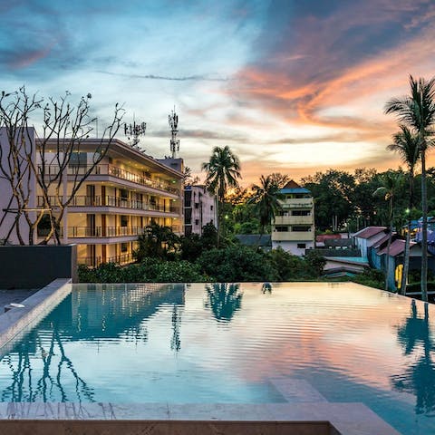 Enjoy sunset swims in the shared infinity pool