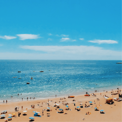 Spend lazy afternoons soaking up the sunshine on Praia da Oura