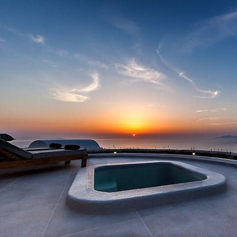 Relax in the jacuzzi at sunset and take in the views over the Aegean Sea 