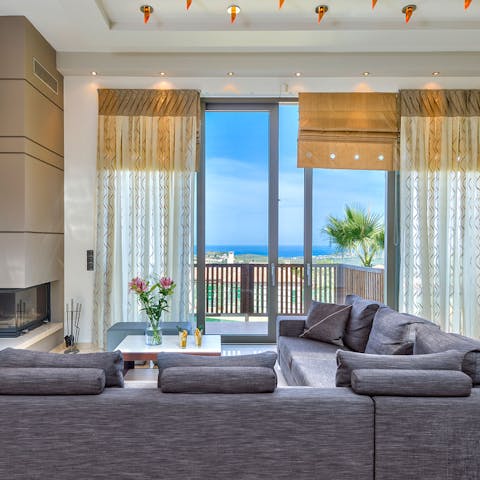 Admire the glistening sea views as you lounge on the sofa
