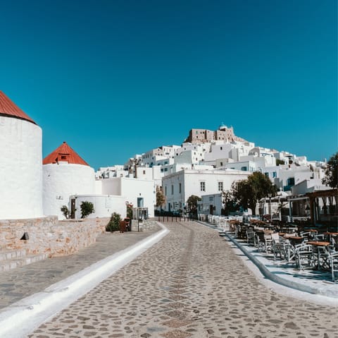 Wander the cobblestone streets of Astypalaia and find idyllic white Grecian architecture