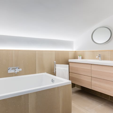 Treat yourself to a long soak in the en-suite tub after a busy day