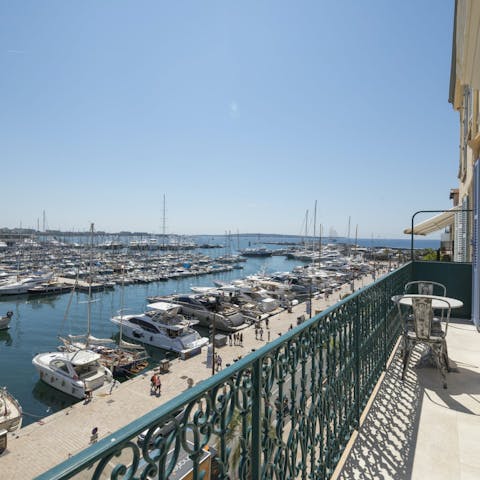 Sip a refreshing glass of kir out on the private balcony with views of the harbour