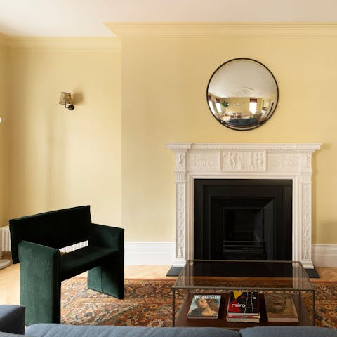 Admire the original feature fireplace of this charming home