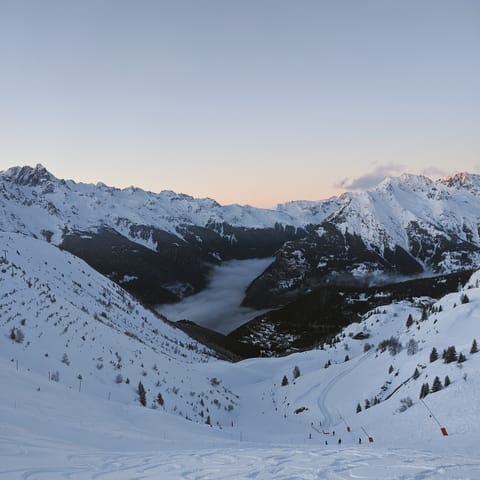 Grab your skis and carve down Pic Blanc, the highest peak in the Alpe d’Huez Grand Domaine area