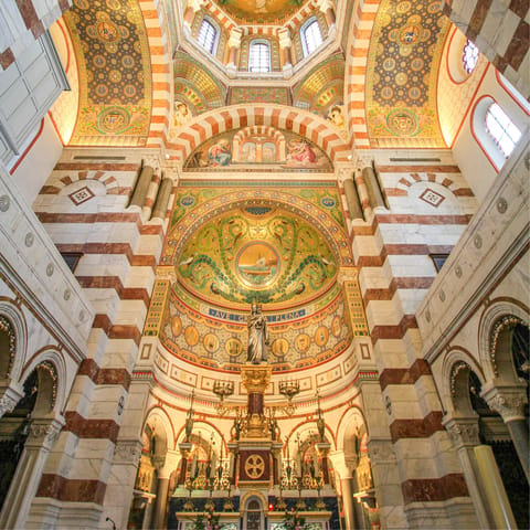 Admire the stunning Basilique Notre-Dame de la Garde, a short walk away