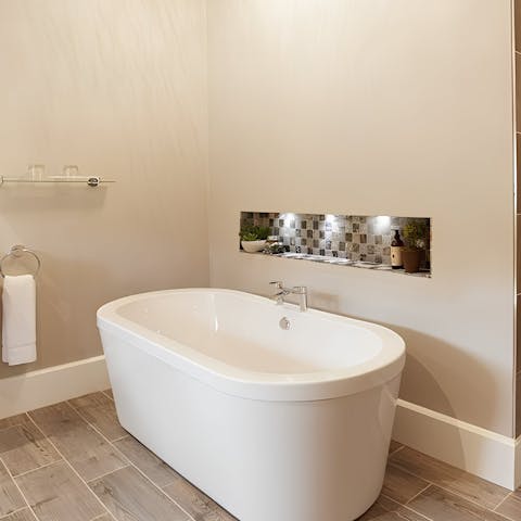 Relax in the freestanding bathtub, with room for two