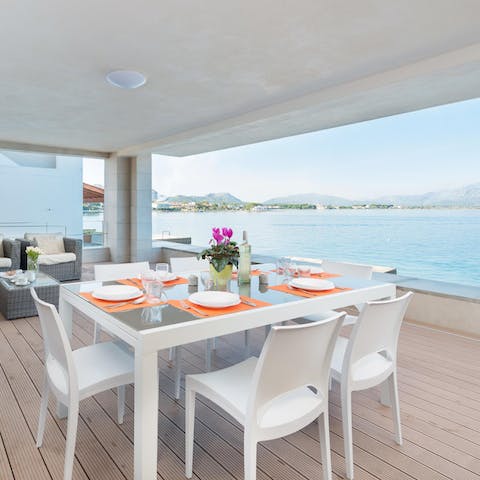 Look forward to meals by the waterside on your covered terrace