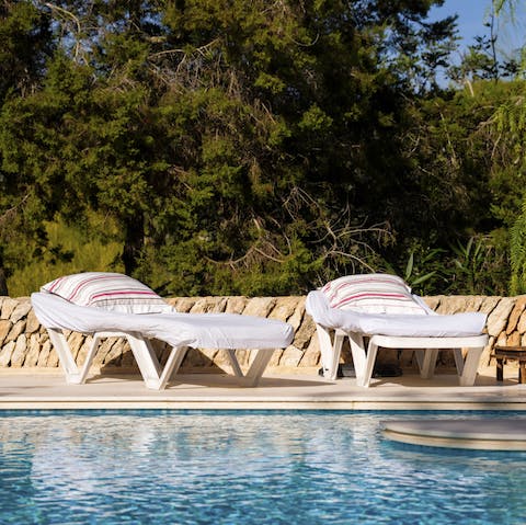 Enjoy a refreshing dip in the pool between sunbathing sessions