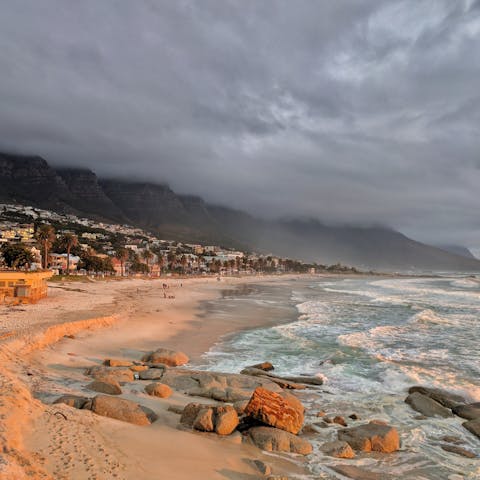 Feel the fresh sea air on your face at Camps Bay, a mere ten-minute drive from your home