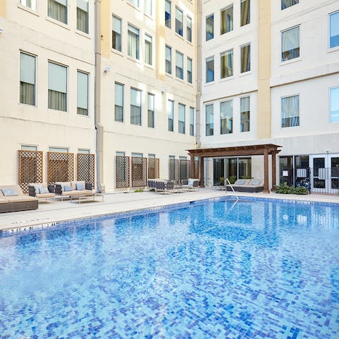 Splash the day away by the outdoor pool, relaxing in the Texas sunshine