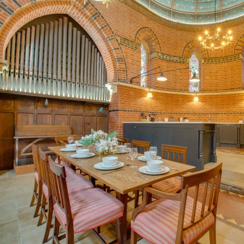 Tuck into hearty English cuisine on your dining set while you admire the original organ above you