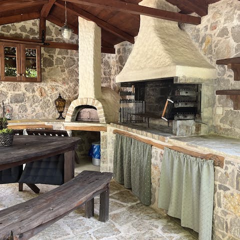 Cook some hirina apakia in the wood-fired oven in the outdoor kitchen