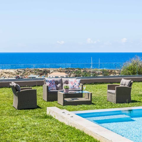 Enjoy a cold drink or two on the lawn with the sea as your backdrop