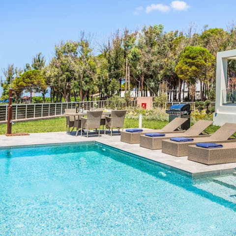 Laze away the day by the crystalline swimming pool