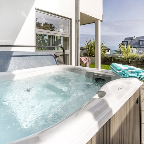Unwind in the hot tub, after a day out in the fresh sea air 