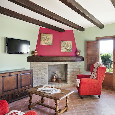 Make yourself at home in the rustic living space with a glass of wine in hand