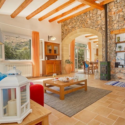 Admire the traditional interior of exposed stone and wooden beams