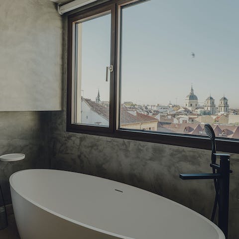 Take in views of the Royal Palace of Madrid from the bathtub 