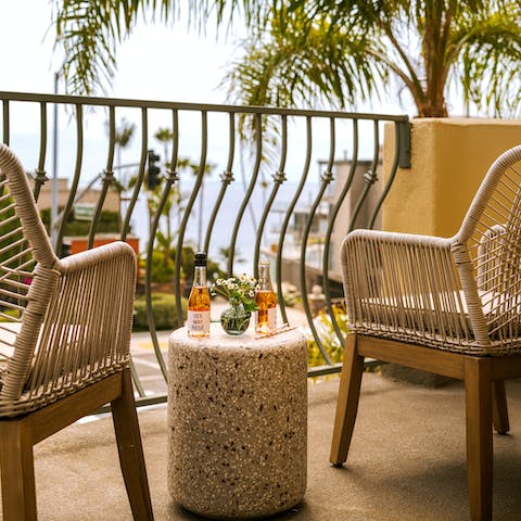 Sip a glass of Californian wine at sunset on the private balcony