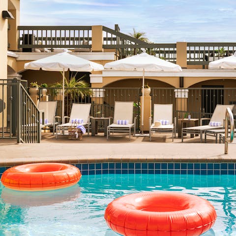 Work on your tan by the communal pool before taking a dip in its cooling waters