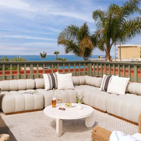 Admire ocean views from the shared rooftop terrace