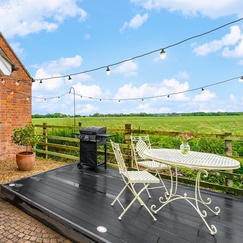 Light up the barbecue on summer evenings to enjoy on the fairy-lit terrace