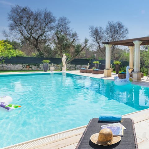 Swim unhurried lengths in the pool before drying off on a lounger