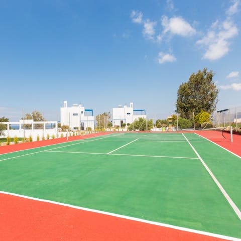 Challenge each other to a game of tennis on the communal courts 