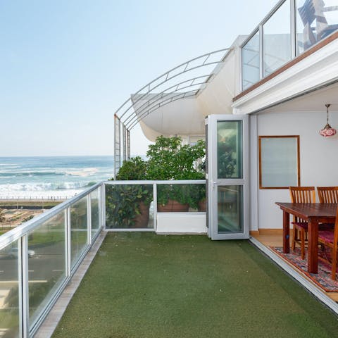 Sip a glass of South African wine on the terrace while drinking in ocean views