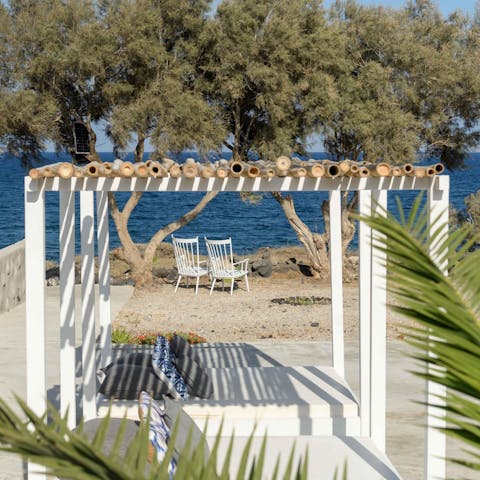 Lie back on your four-poster loungers with a cocktail in hand
