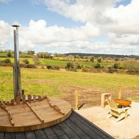 Soothe aching muscles in the wood-fired hot tub, or sip sundowners by the fire