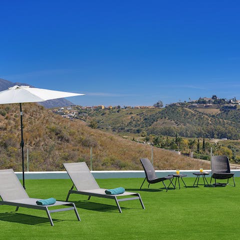 Admire far reaching views from the artificial grass terrace