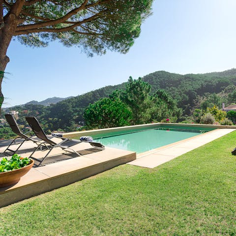 Cool off in the private pool as you take in the sweeping mountain views
