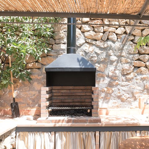 Get the built-in brick barbecue going for a feast outside