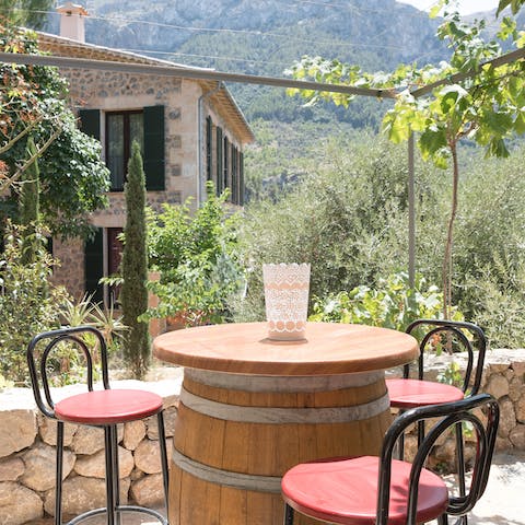 Take your evening drink at the rustic-style barrel on the terrace