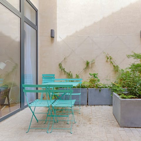 Enjoy a glass of wine in the shared courtyard
