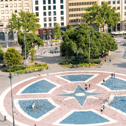 Have a stroll around the fountains and statues of Plaça Catalunya, a ten-minute walk away