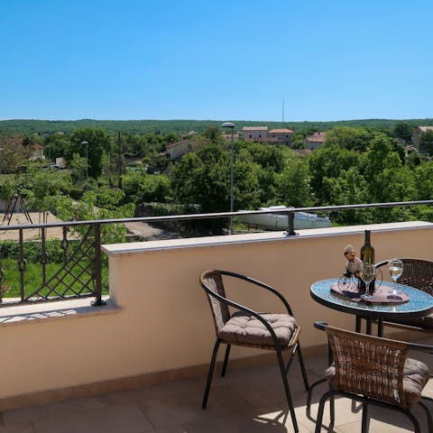 Admire the verdant scenery over a few ice-cold drinks on the balcony