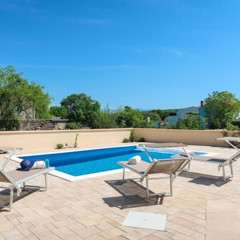 Relax after a revitalising dip in your private pool