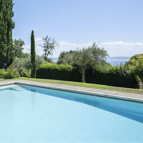 Enjoy views of Lago di Bracciano from the pool