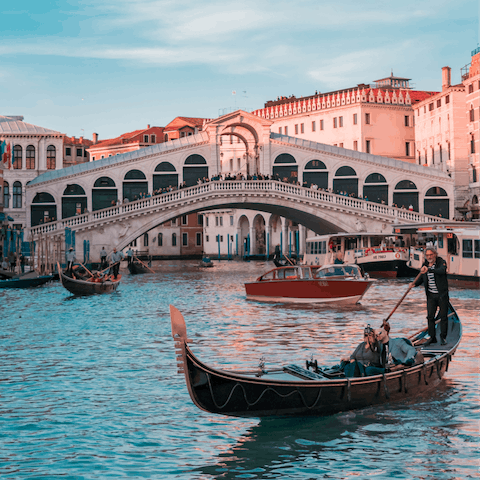 Head to the iconic Rialto Bridge, a fifteen-minute walk away